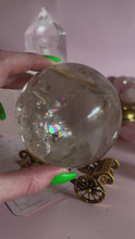 Load and play video in Gallery viewer, Clear Quartz with Golden Healer and Rainbows Sphere 002

