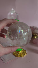 Load and play video in Gallery viewer, Clear Quartz with Golden Healer and Rainbows Sphere 003
