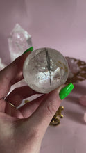 Load and play video in Gallery viewer, Tourmalinated Quartz with Golden Healer and Rainbows Sphere 002
